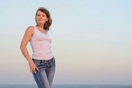 Girl on the sky backgroundの写真素材