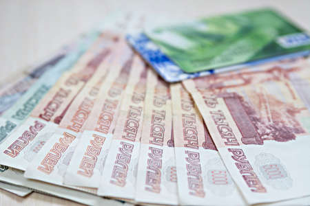 a credit card and the Russian rubles on a white backgroundの写真素材
