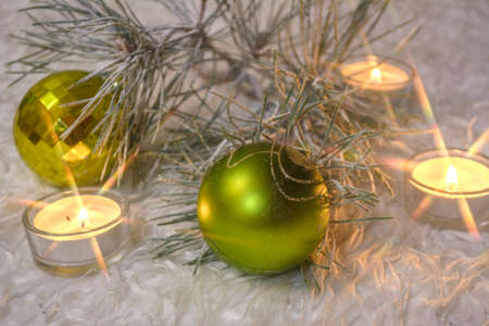 Christmas balls and fir-tree in snow candlesの写真素材