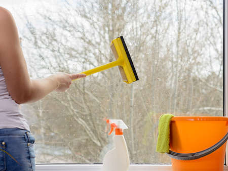 girl washes a window