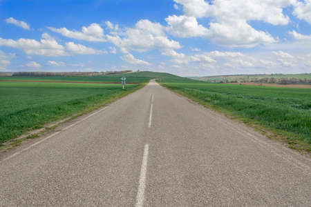 motorway leading into the distance in the clear skyの写真素材