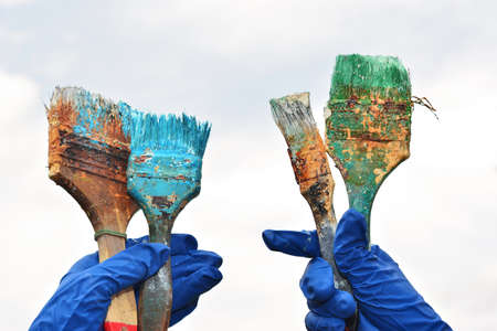 the hand holds the brush to paintの写真素材