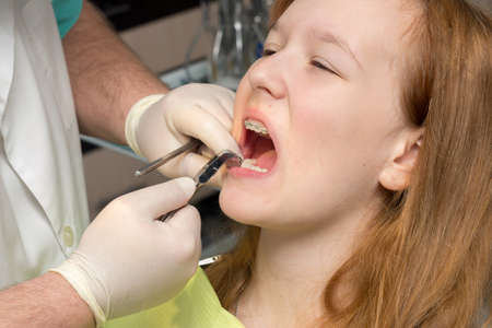 girl in the dentist's chair with braces