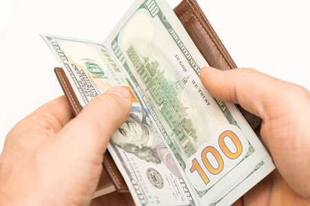 hundred-dollar bills in his hand