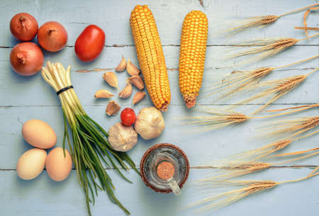 still life of vegetables and eggs and cerealの写真素材