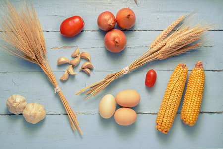 still life of vegetables and eggs and cerealの写真素材