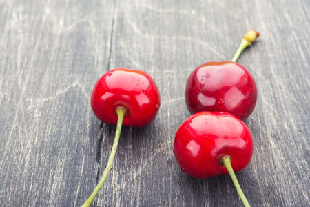 ripe black cherry with chopsticks