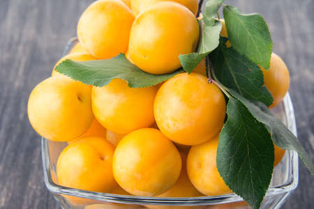 cherry plum lying in a vaseの写真素材