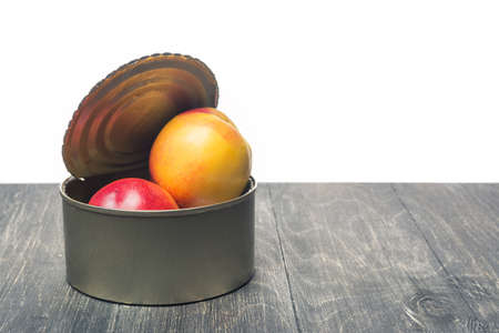 an outdoor tin can with fruitの写真素材