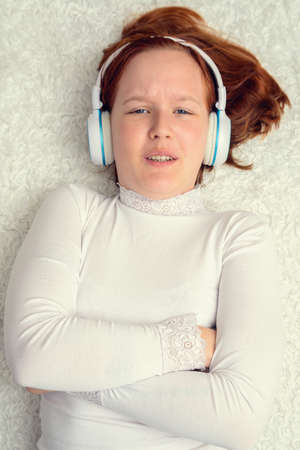 Girl with headphones listening to music