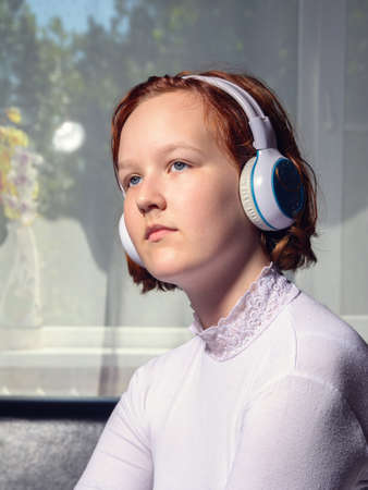 Girl with headphones listening to musicの写真素材