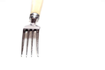 Cutlery fork over white backgroundの写真素材