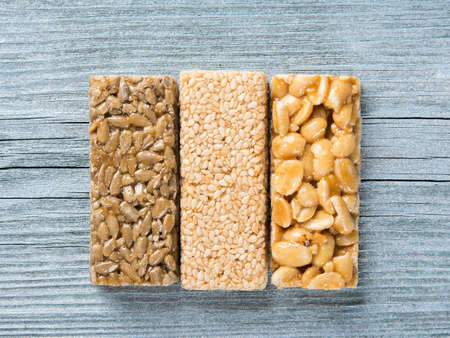 seeds of sunflower, nuts and sesame in caramel in the form of barsの写真素材