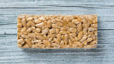 sunflower seeds in caramel in the form of a barの写真素材