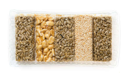 seeds of sunflower, nuts and sesame in caramel in the form of barsの写真素材