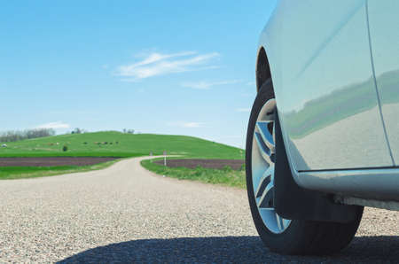 car on the road wheel type asphalt grip reliability travel freedomの写真素材