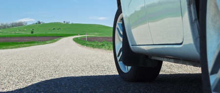 car on the road wheel type asphalt grip reliability travel freedomの写真素材