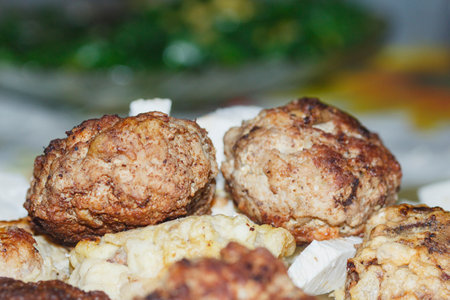 fried meatballs on a table in a restaurant, close-upの写真素材