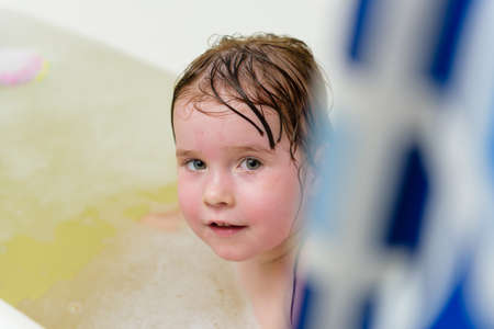 The girl in the bathroom bathing