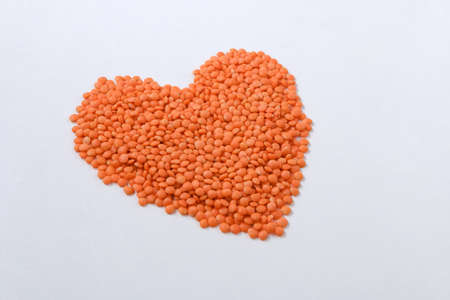 Red lentils on a white background. Healthy food.の写真素材
