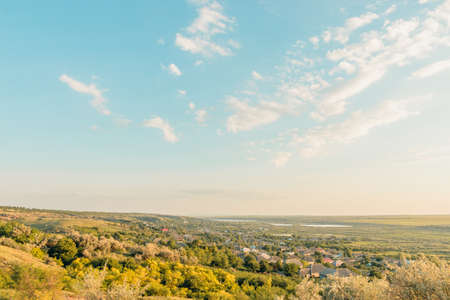 View of countryside at sunset. Autumn is coming. Yellow grass, Blue skyの写真素材