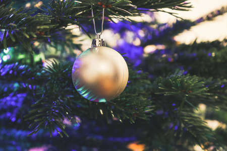 Christmas decoration on christmas tree, bokeh lightsの写真素材