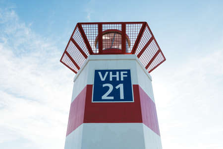 Lighthouse on the sea under sky in the Netherlandsの写真素材