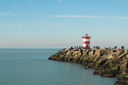 Lighthouse on the sea under sky in the Netherlands