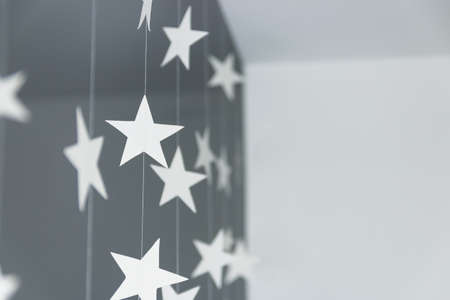 Krafted white paper stars on strings ropeの写真素材