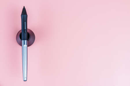 Graphic digital pen on pink colour background.