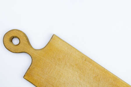 half of wooden cutting board on white background.の写真素材