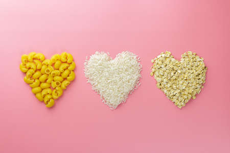 cereals hearts shape from pasta, rice and oats, valentines day background.の写真素材