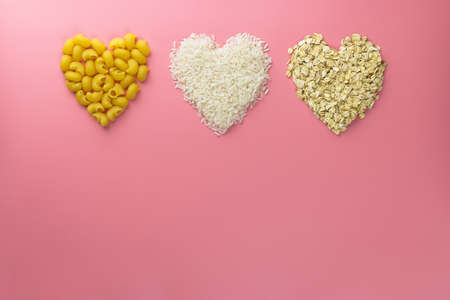 cereals hearts shape from pasta, rice and oats, valentines day background.の写真素材