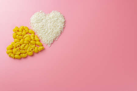 two hearts shape from pasta, rice valentines day background.の写真素材