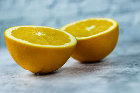 cut oranges on a concrete light background.の写真素材