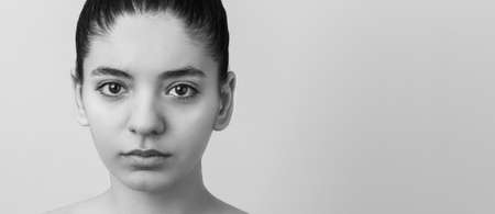 inequality. social abuse over woman. closeup woman in tears. black and white photographyの写真素材