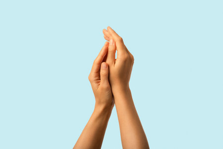 Skin protection and care. Beautiful soft moisturized female hands closeupの写真素材