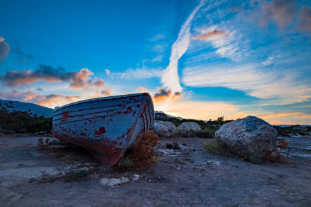 old boat on the background of the morning cloudy sky. Elafonisi beach Crete Greeceの写真素材