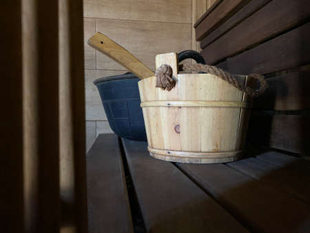 bucket in a sauna with a spoonの写真素材