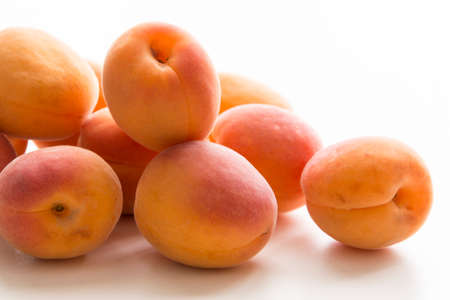 Organic healthy apricots on white backgroundの写真素材