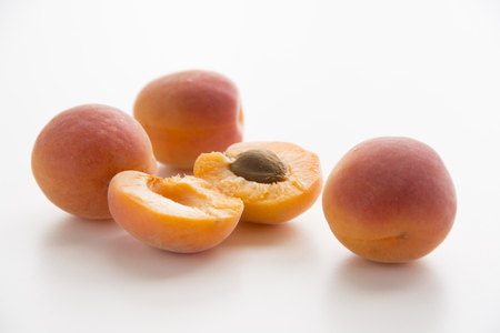 Organic healthy apricots on white backgroundの写真素材