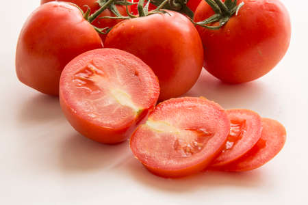 Tomatoes on white background, vegetarian healthy nutritionの写真素材
