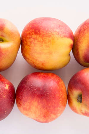 Sweet juicy nectarrine fruit on white backgroundの写真素材