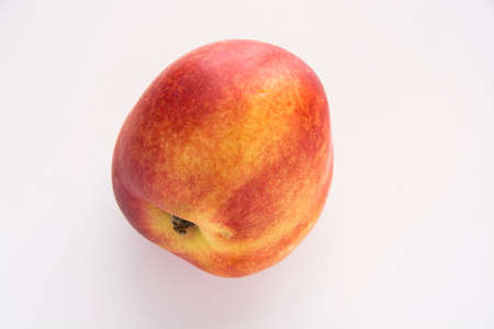 Sweet juicy nectarrine fruit on white backgroundの写真素材