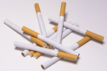 Cigarette on white background, unhealthy lifestyle, toxic nicotineの写真素材