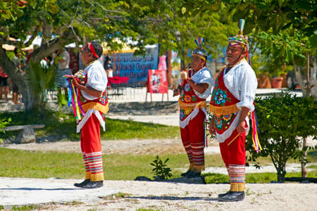 TULUM, MEXICO - NOVEMBER 2, 2010: Maya Indian street performers a.k.a Flying Mayans performing Maya Cultural traditional stunts on November 2, 2010 in Tulum, Mexico by Maya Ruins Archaeological Site.のeditorial素材