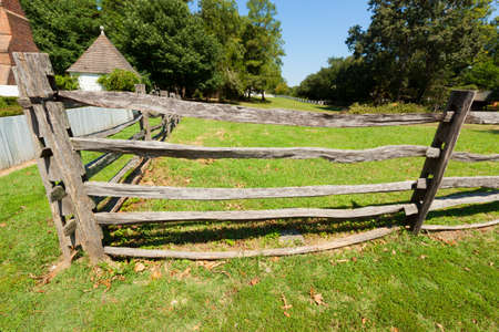 View of the ancient wooden fence on the farm.の写真素材