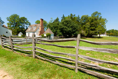 View of the ancient wooden fence on the farm.の写真素材
