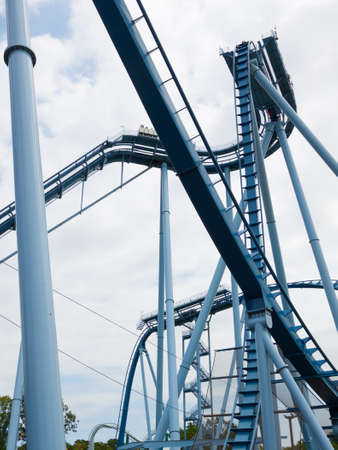 Steel loops of the extreme rollercoaster ride in the amusement park.