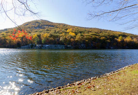 Beautiful fall colors by the forest lake.